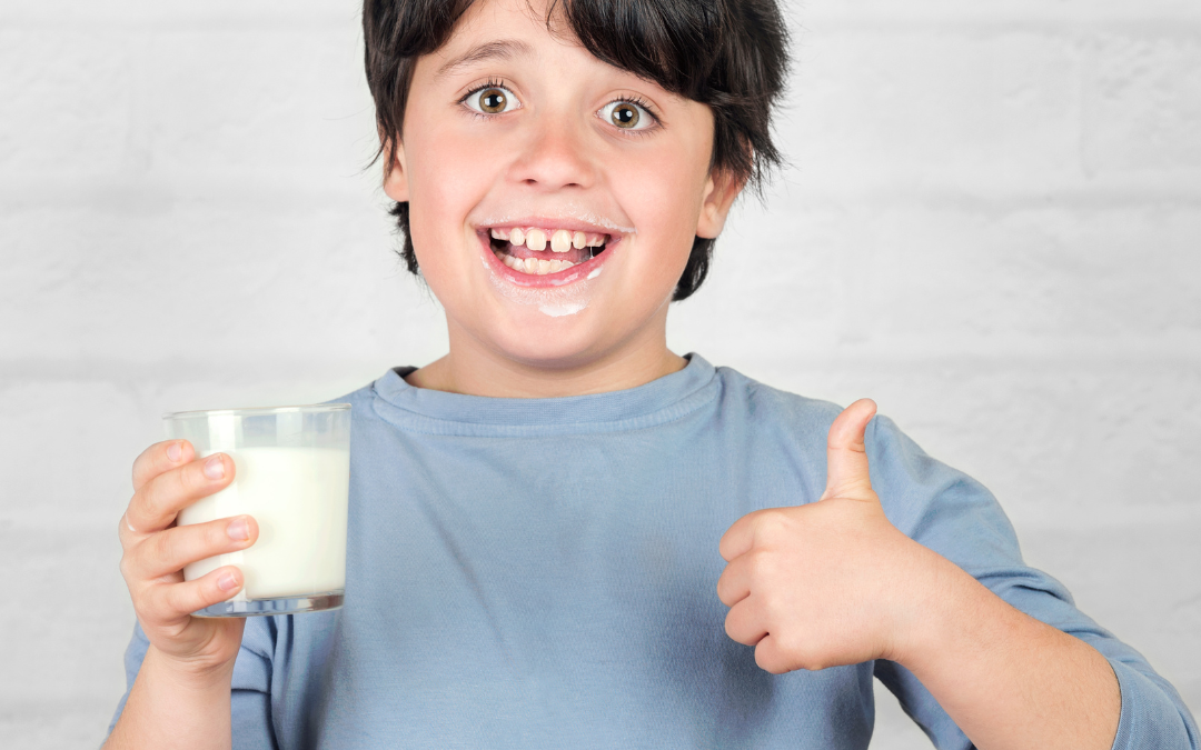 Child Drinking Milk With Thumbs Up